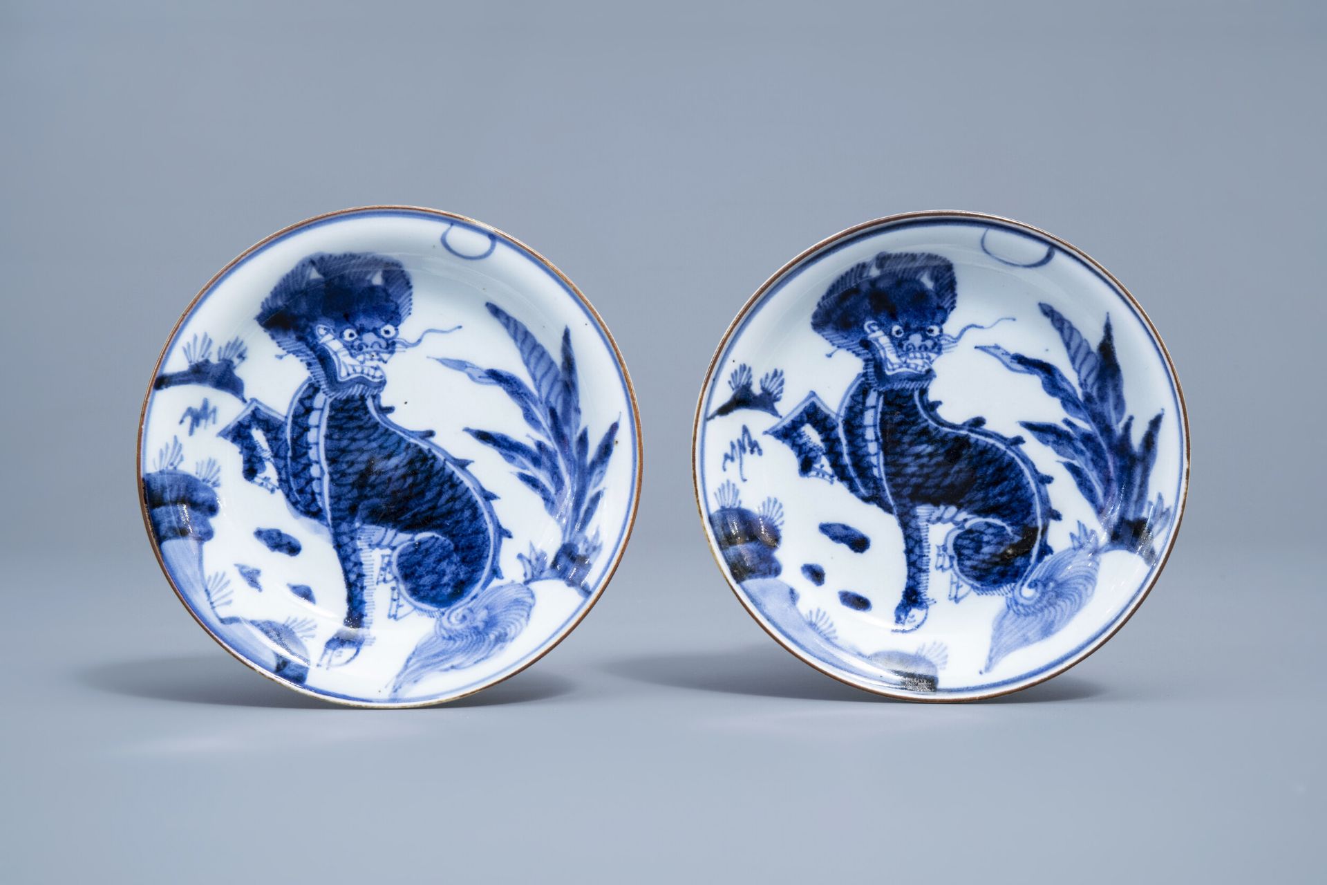 A pair of Japanese blue and white 'komainu' saucer dishes, marked, Edo, 18th C.