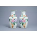 A pair of Chinese famille rose vases with floral design, 19th/20th C.