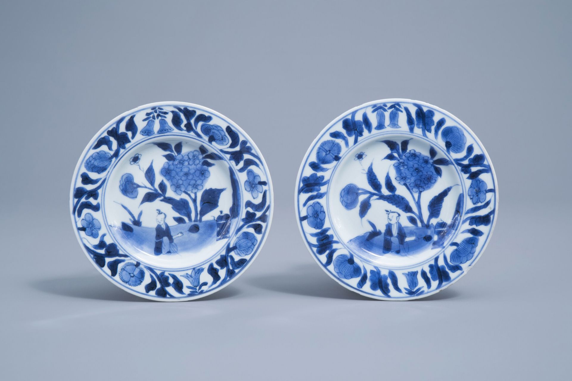 A pair of Chinese blue and white saucers with a boy in a landscape, Transitional period, 17th C.