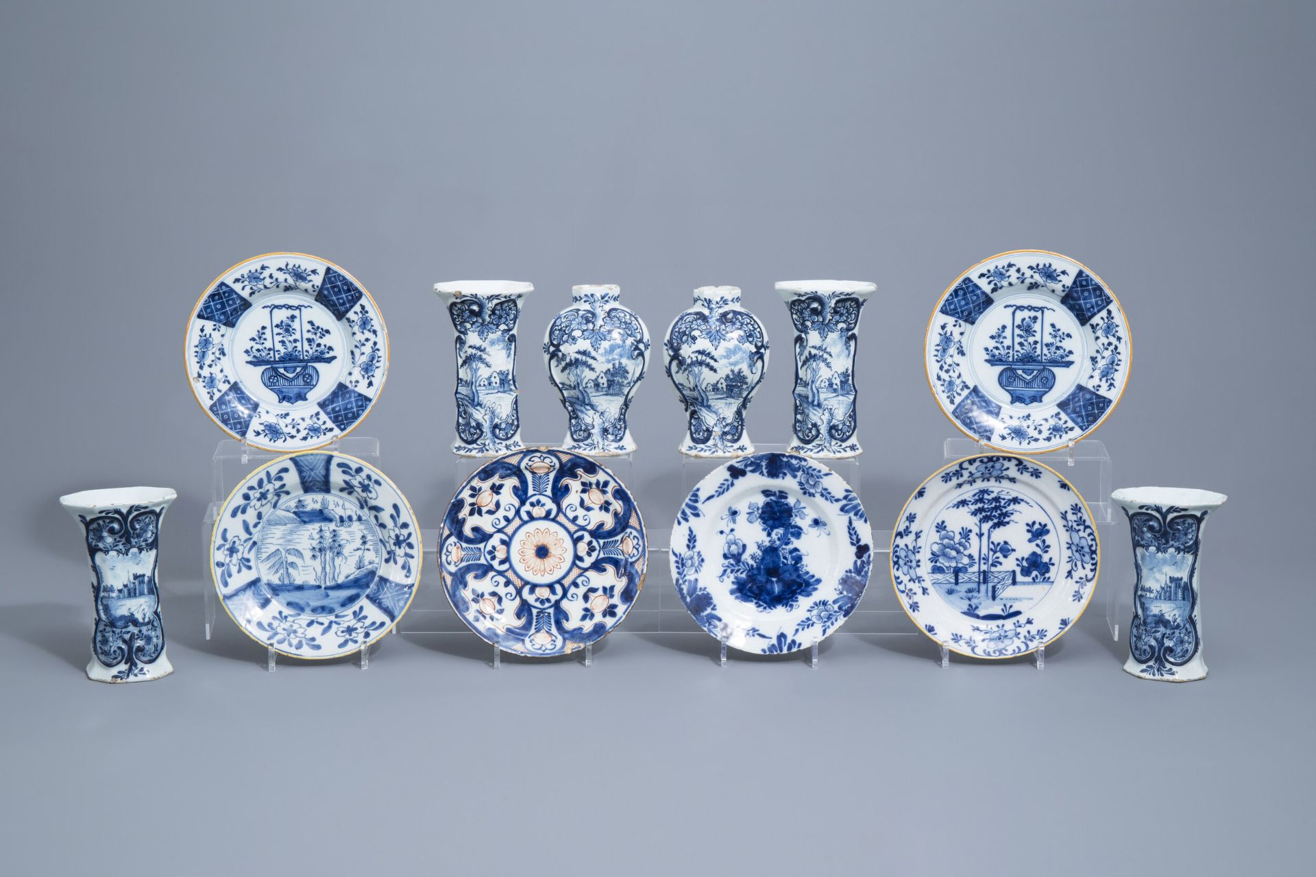 Six Dutch Delft blue and white vases and six plates, 18th C.