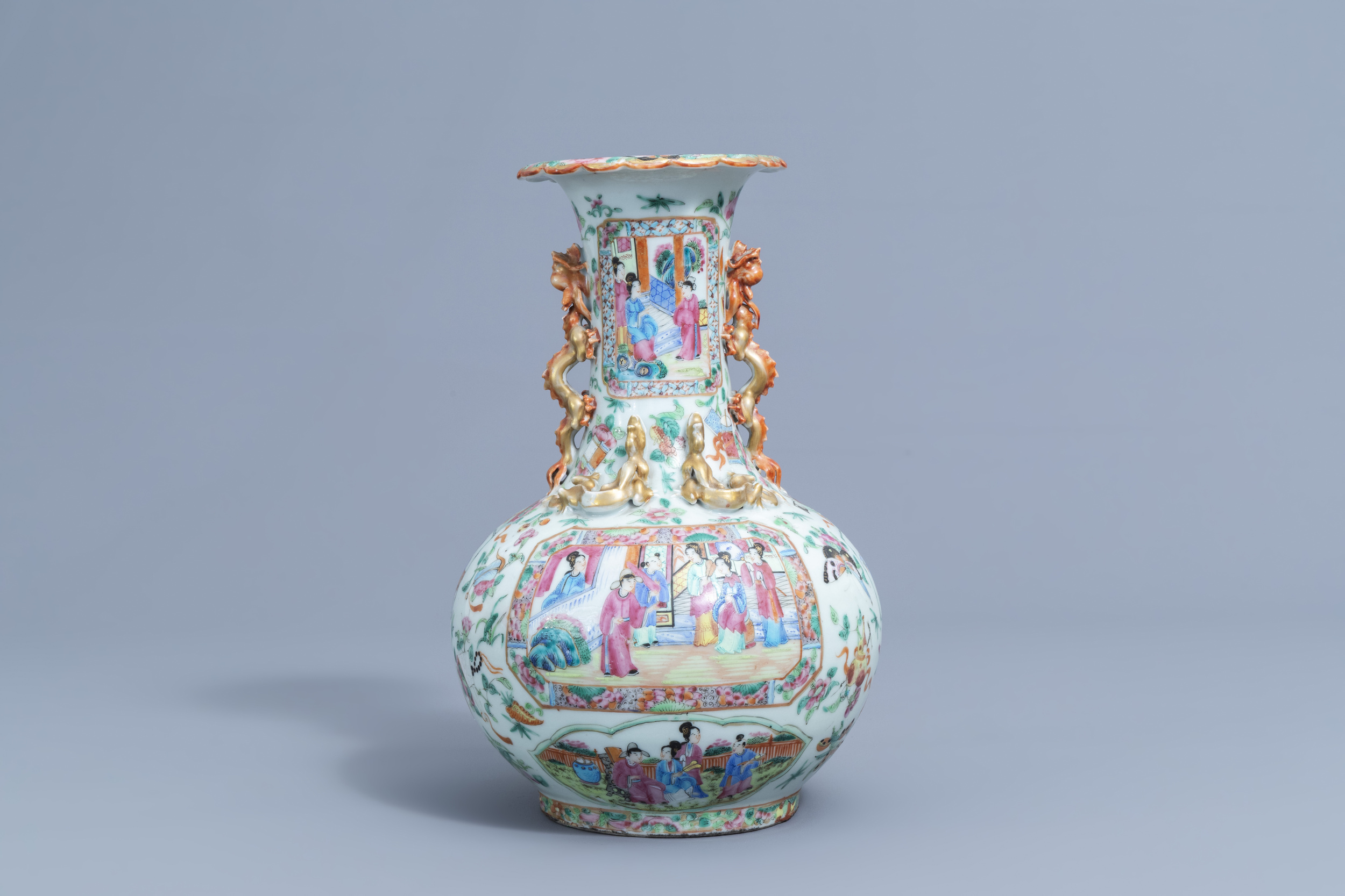 A Chinese Canton famille rose bottle vase with relief design, 19th C. - Image 3 of 6