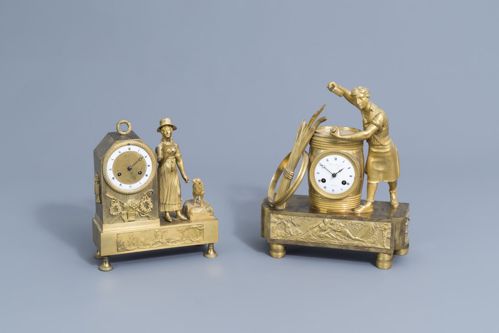 Two French gilt bronze mantel clocks, 19th C.