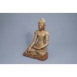 A tall inlaid gilt wood figure of a seated Buddha, Burma or Thailand, 19th/20th C.