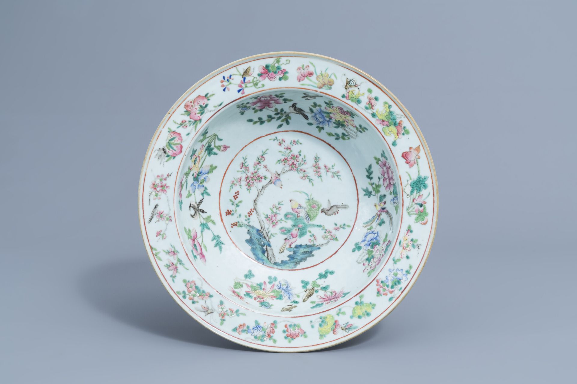 A Chinese famille rose bowl with birds among blossoming branches, 19th C.