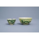 Two Chinese yellow ground green 'dragon' bowls, Kangxi and Yongzheng marks, 19th/20th C.