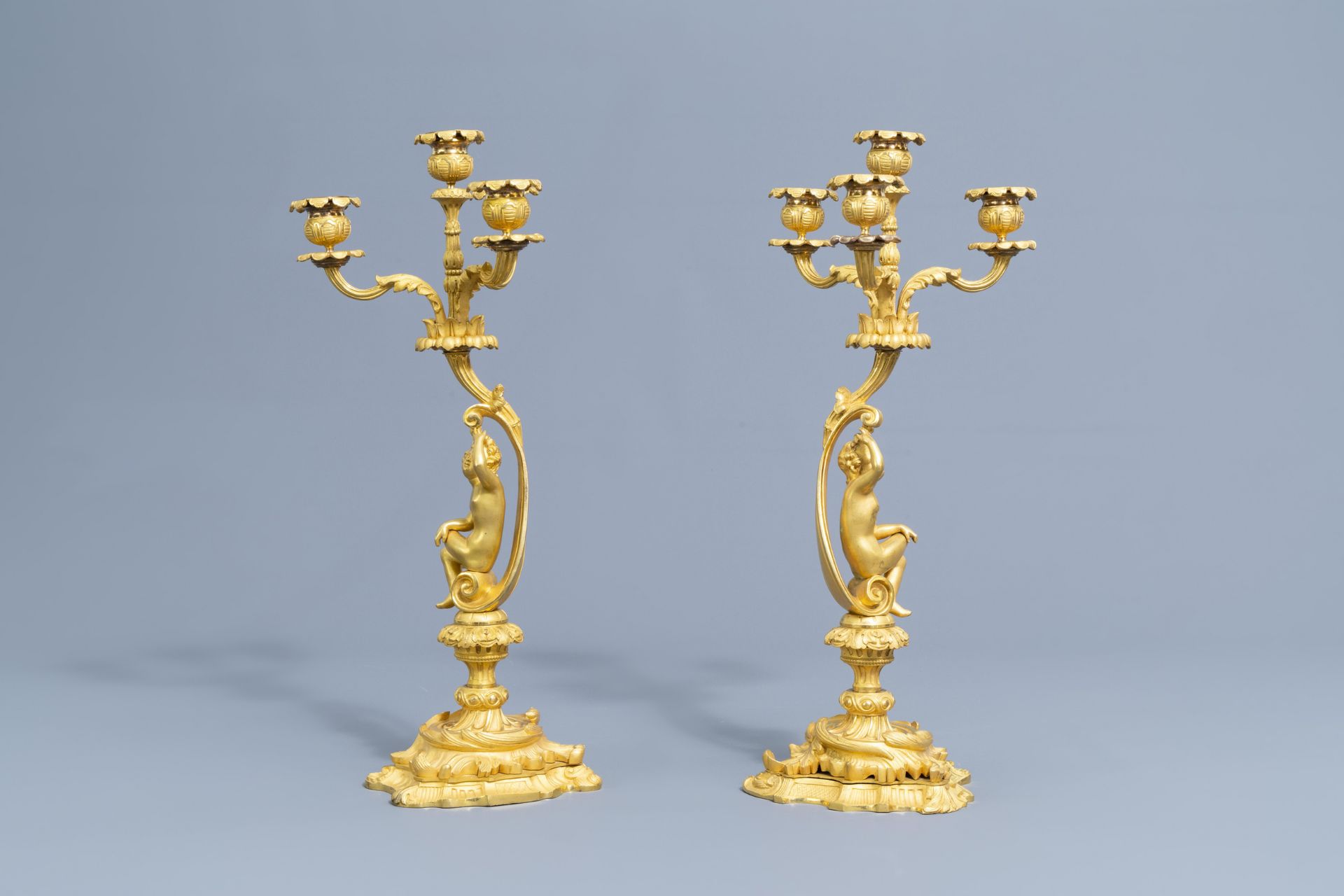 A French gilt bronze mounted Sevres style clock and a pair of Louis XV style candelabra, 19th C. - Image 21 of 23