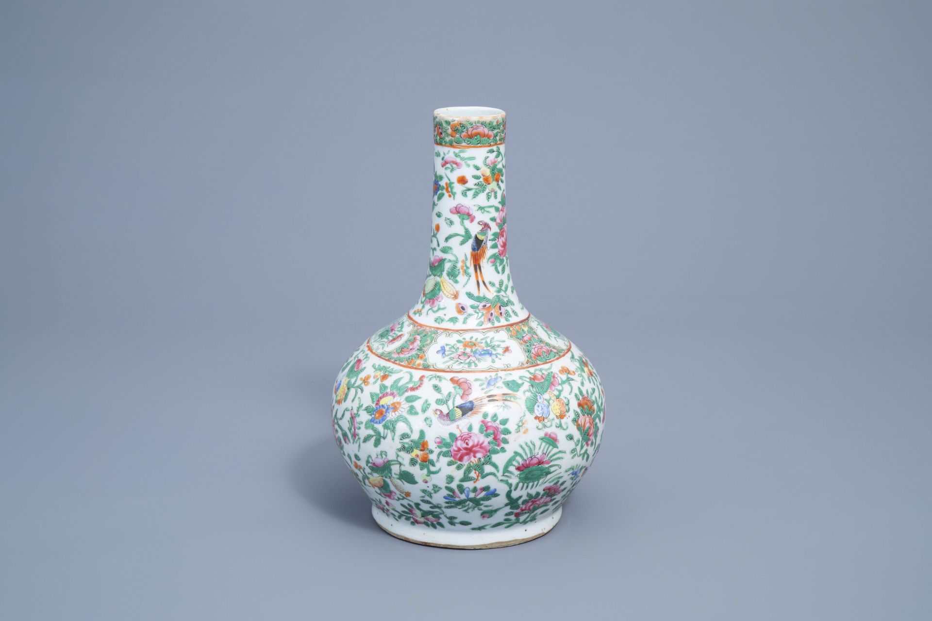 A Chinese Canton famille rose bottle vase with floral design, 19th C.