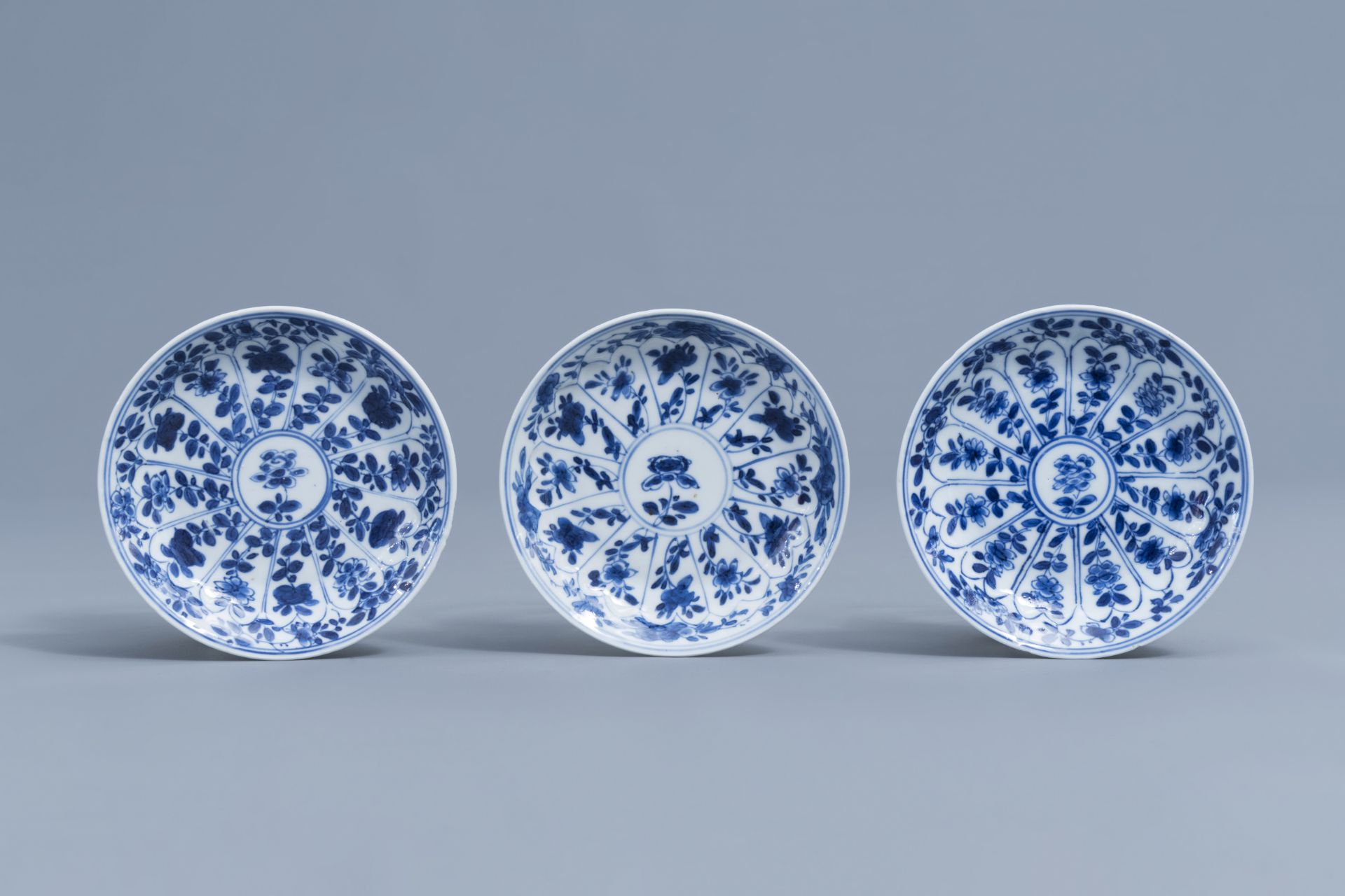 Three Chinese blue and white cups and saucers with floral design, Kangxi - Image 2 of 9