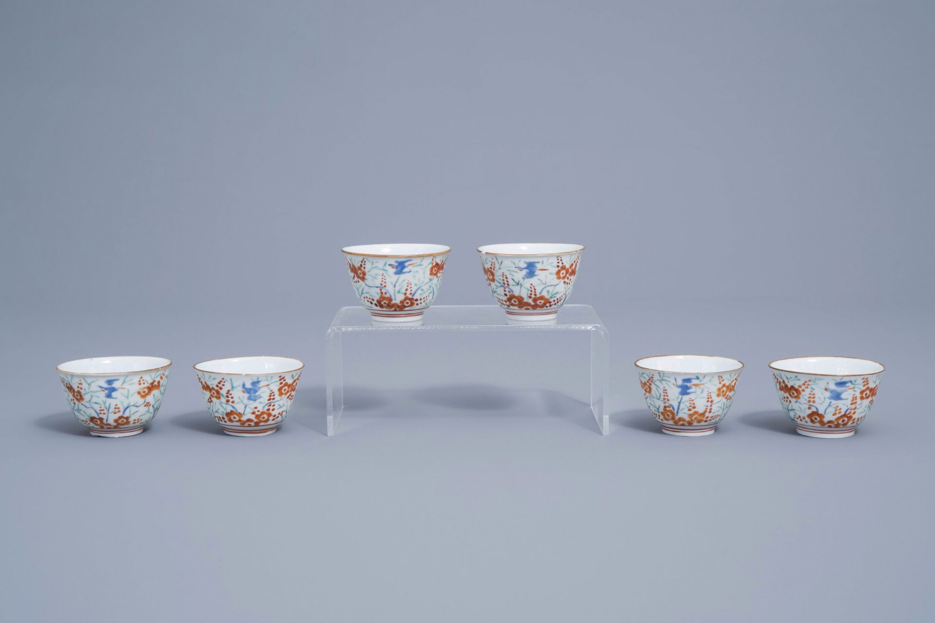 Six Japanese Kakiemon cups with parrots among blossoming branches, Edo, 18th C.