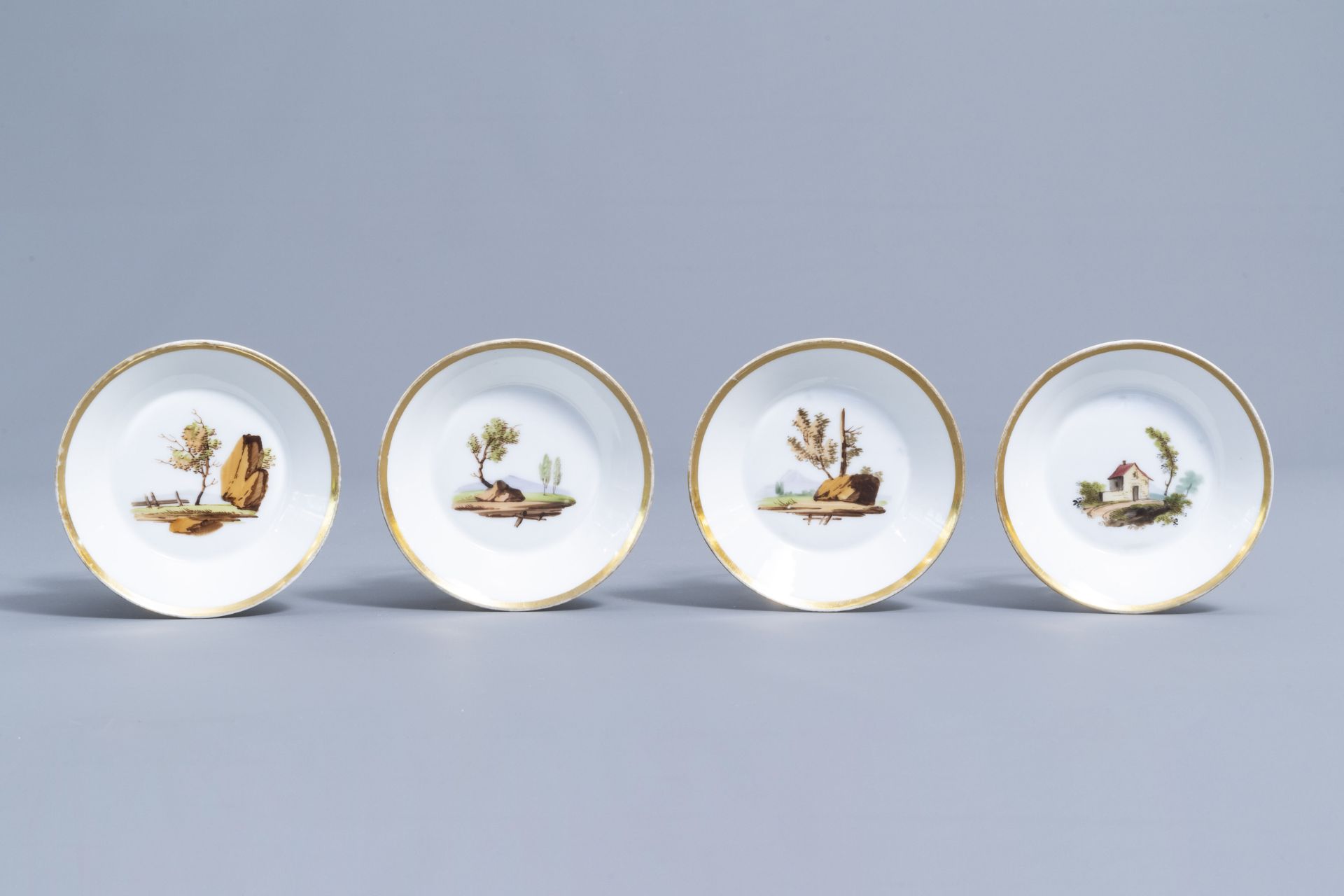 A 21-piece Paris polychrome and gilt porcelain coffee and tea service with landscapes, 19th C. - Image 27 of 46
