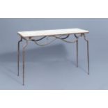Attr. to RenŽ Prou (1889-1947): A wrought iron console with 'pierre de Bourgogne' top, mid 20th C.