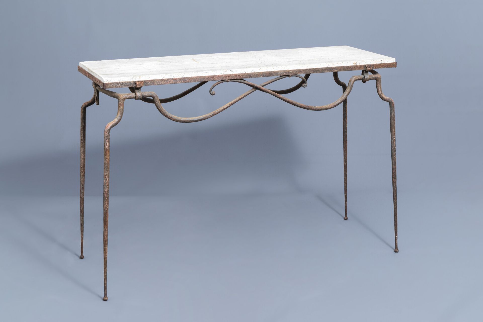 Attr. to RenŽ Prou (1889-1947): A wrought iron console with 'pierre de Bourgogne' top, mid 20th C.