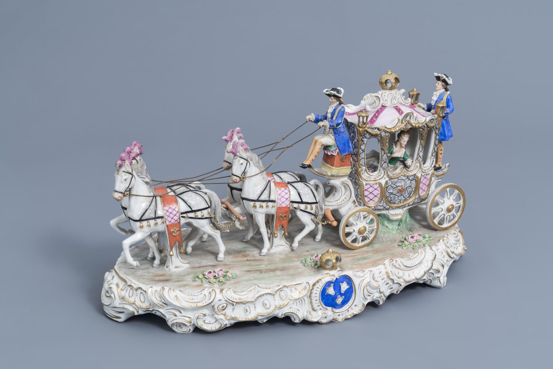 A group with a four-in-hand carriage in polychrome Saxon porcelain, Sitzendorf mark, 20th C.