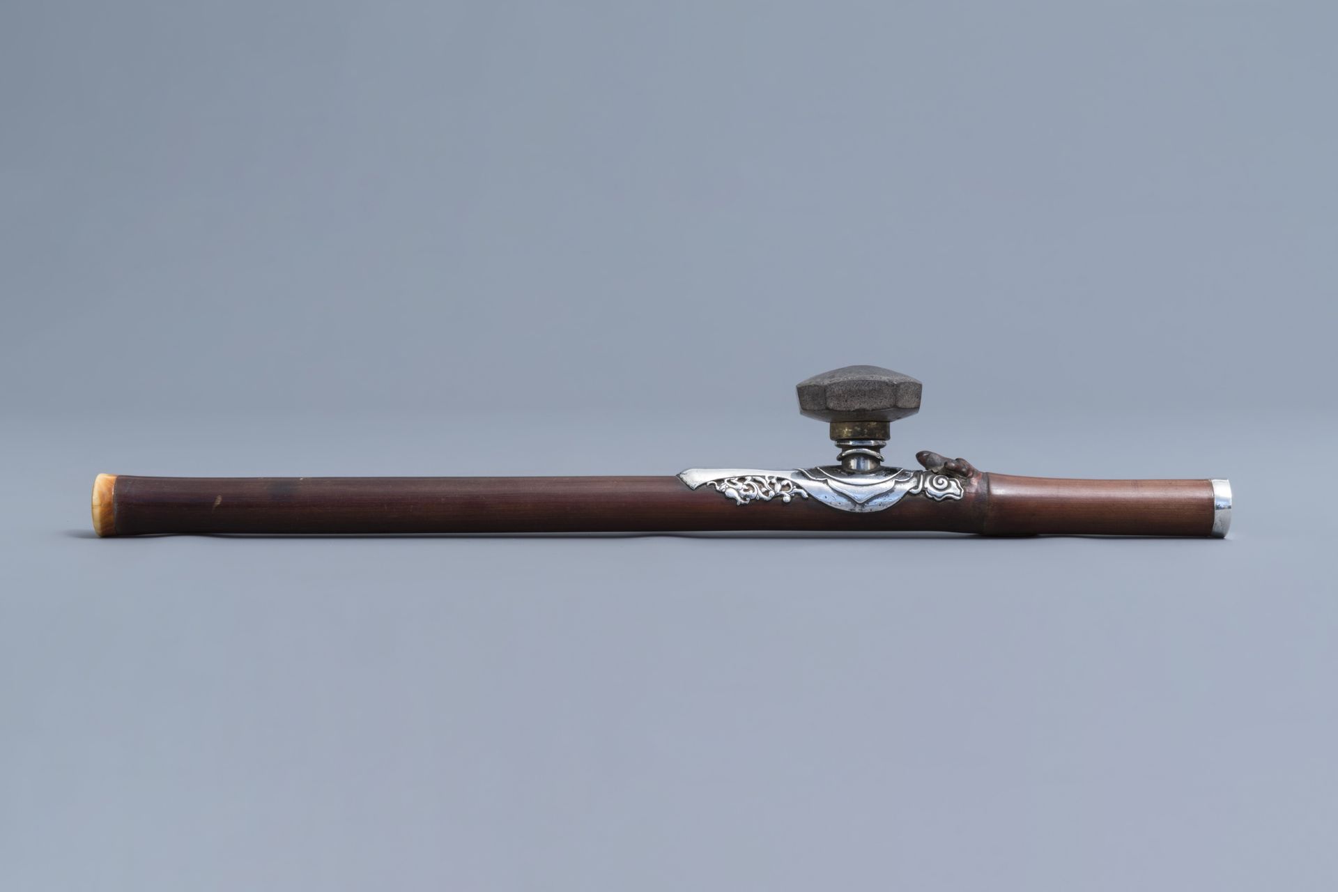 A Chinese bamboo opium pipe with silver saddle, ivory mouthpiece and stoneware damper, 19th C. - Image 4 of 10