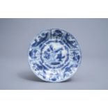 A Chinese blue and white kraak porcelain dish with figures in a landscape, Wanli