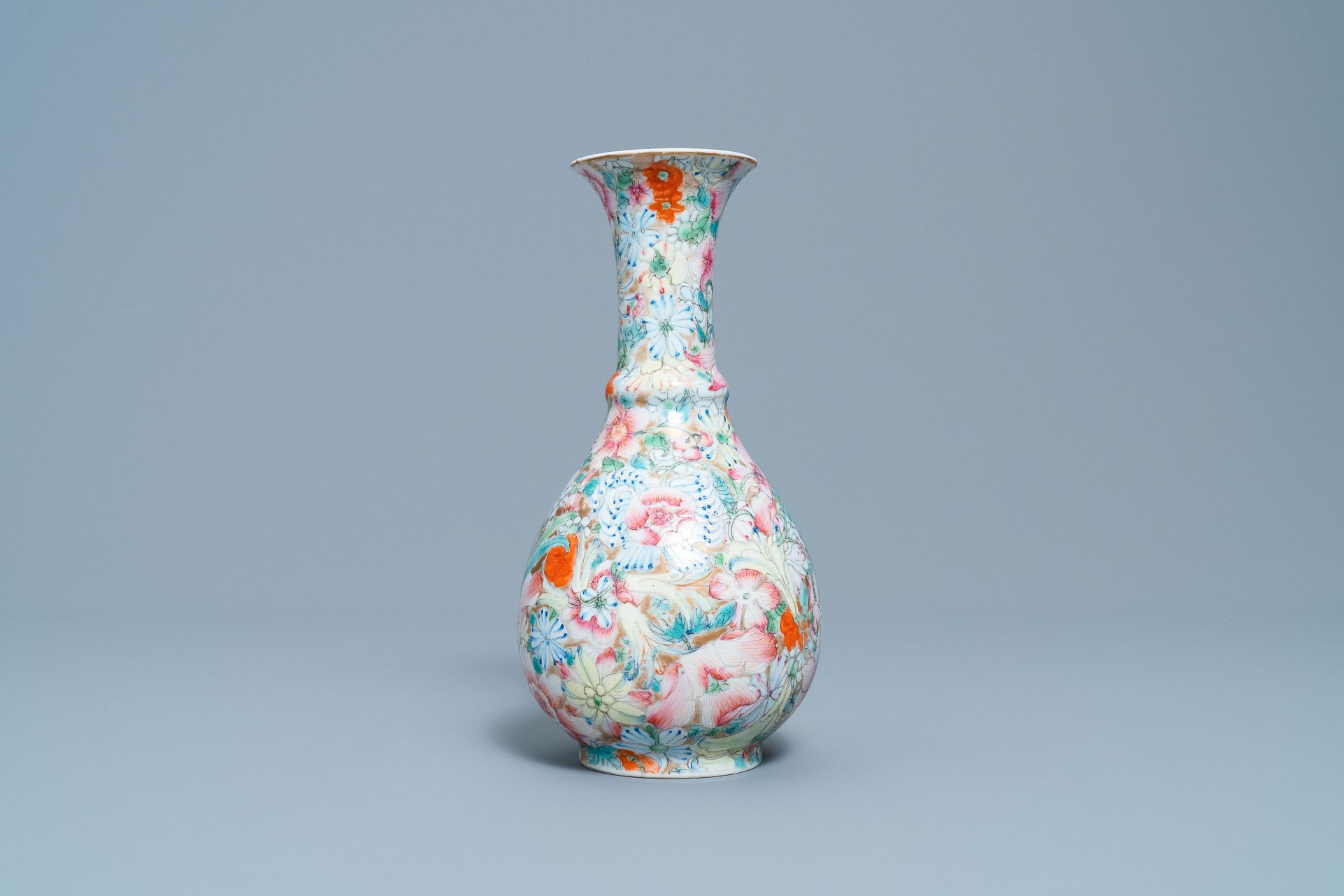 A Chinese famille rose 'millefleurs' vase, Qianlong mark, Republic, 20th C. - Image 2 of 6