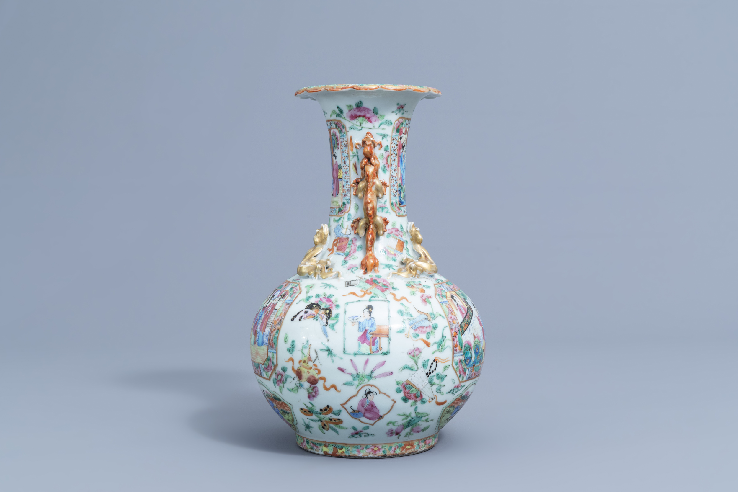 A Chinese Canton famille rose bottle vase with relief design, 19th C. - Image 2 of 6