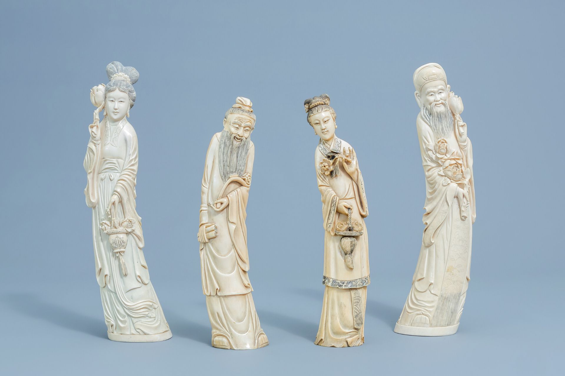 Four various Chinese carved ivory figures, first half of the 20th C.