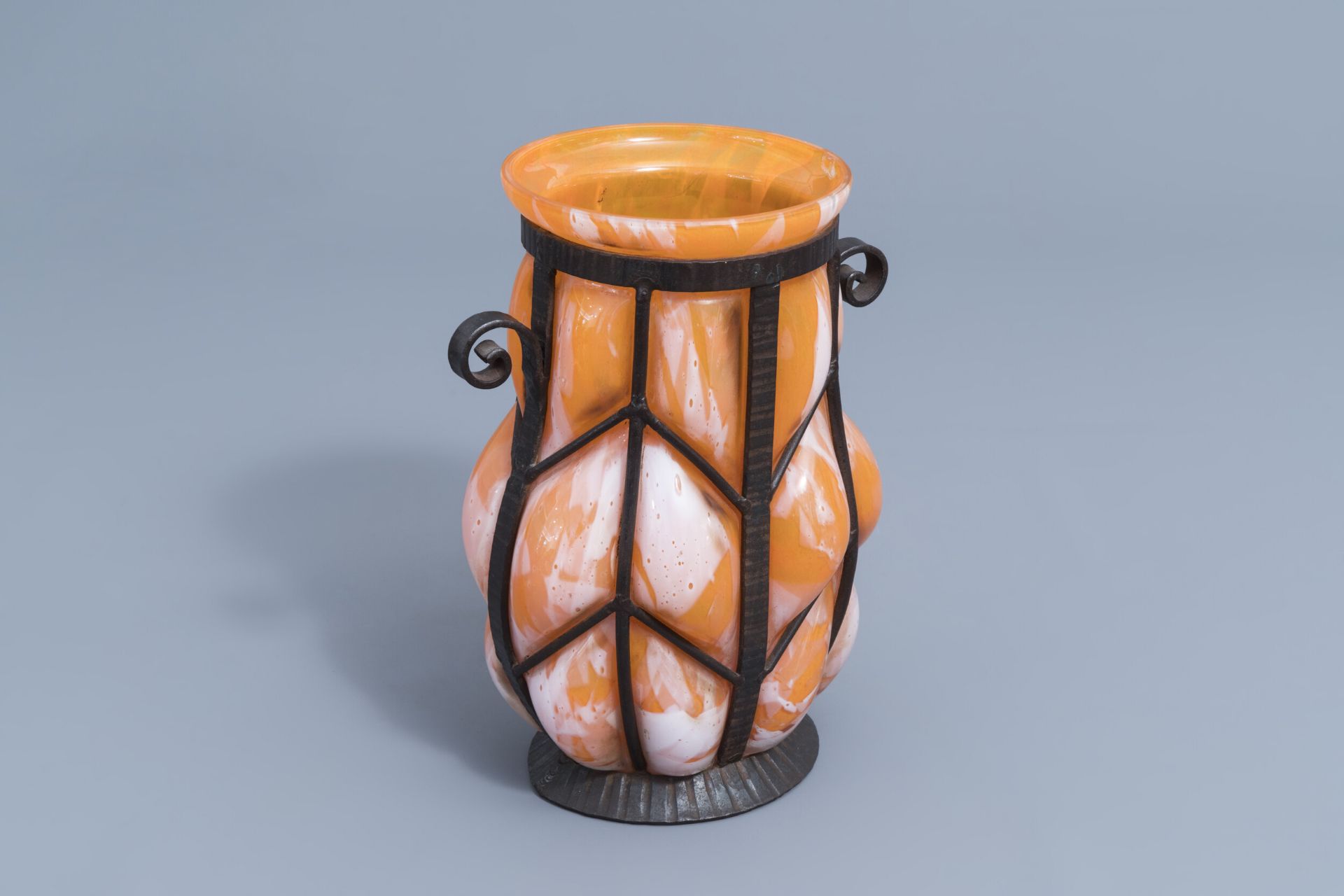 A French glass and wrought iron Art Deco vase, probably Verreries d'Art Lorrain, 20th C.