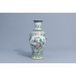 A Chinese famille verte baluster vase with birds among blossoming branches, 19th/20th C.