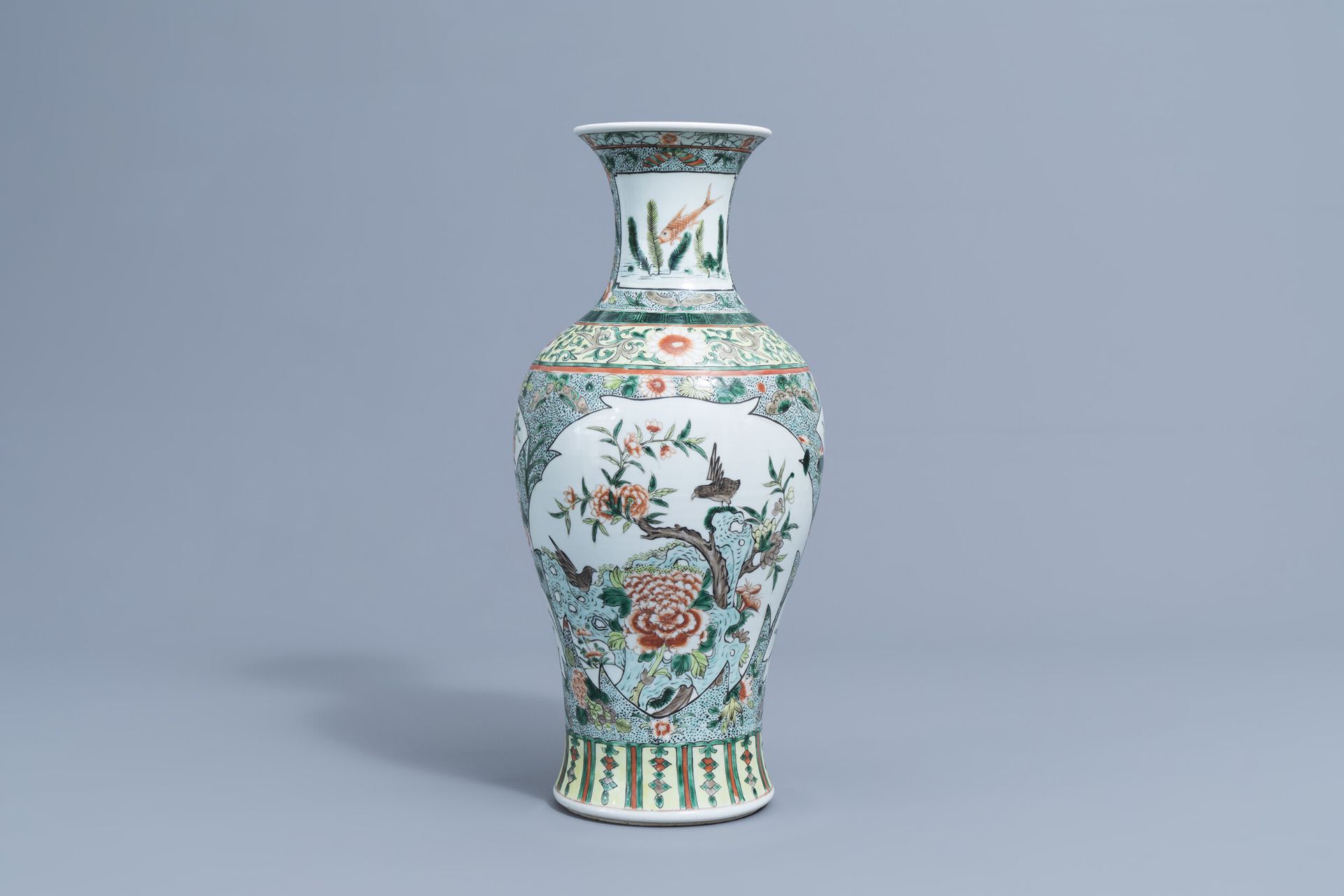 A Chinese famille verte baluster vase with birds among blossoming branches, 19th/20th C.