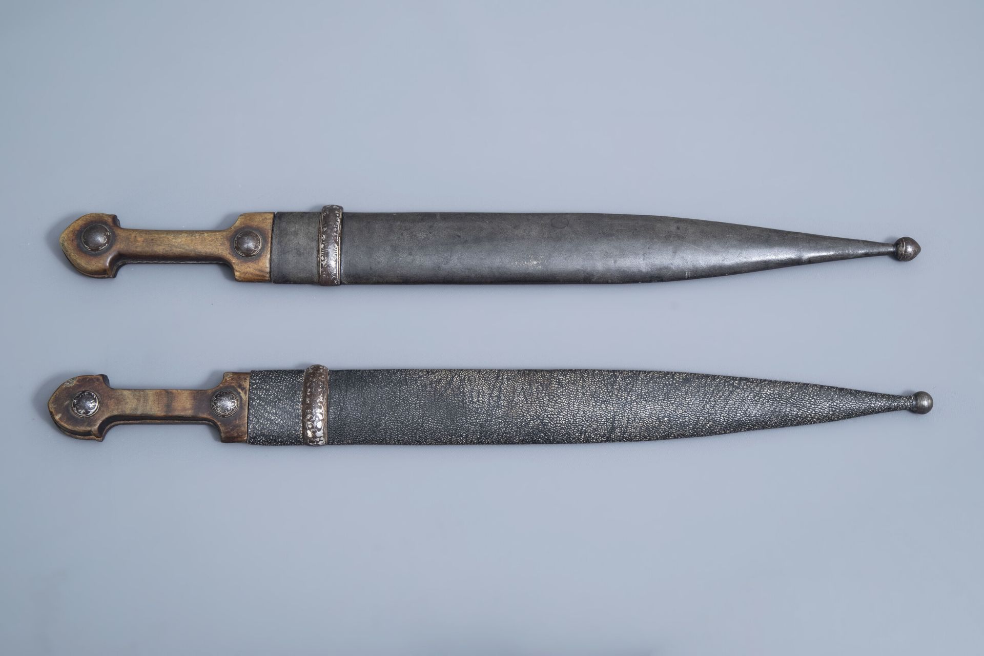 Two Caucasian 'kindjal' daggers with accompanying scabbard, 19th/20th C.