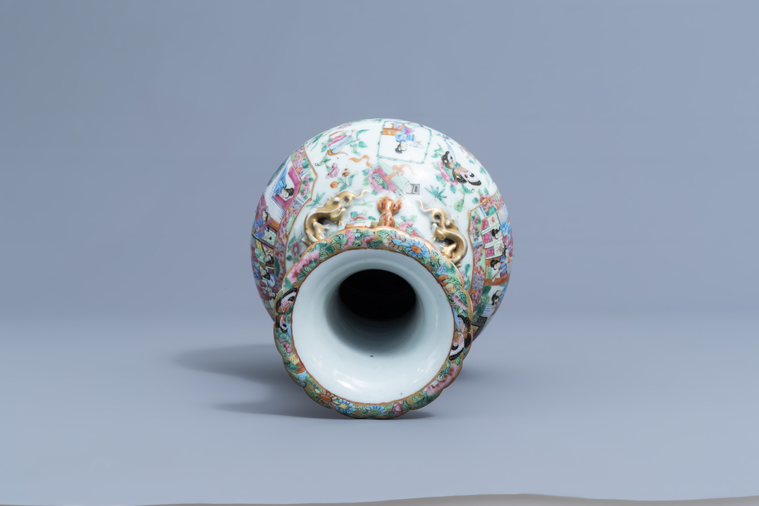 A Chinese Canton famille rose bottle vase with relief design, 19th C. - Image 6 of 6