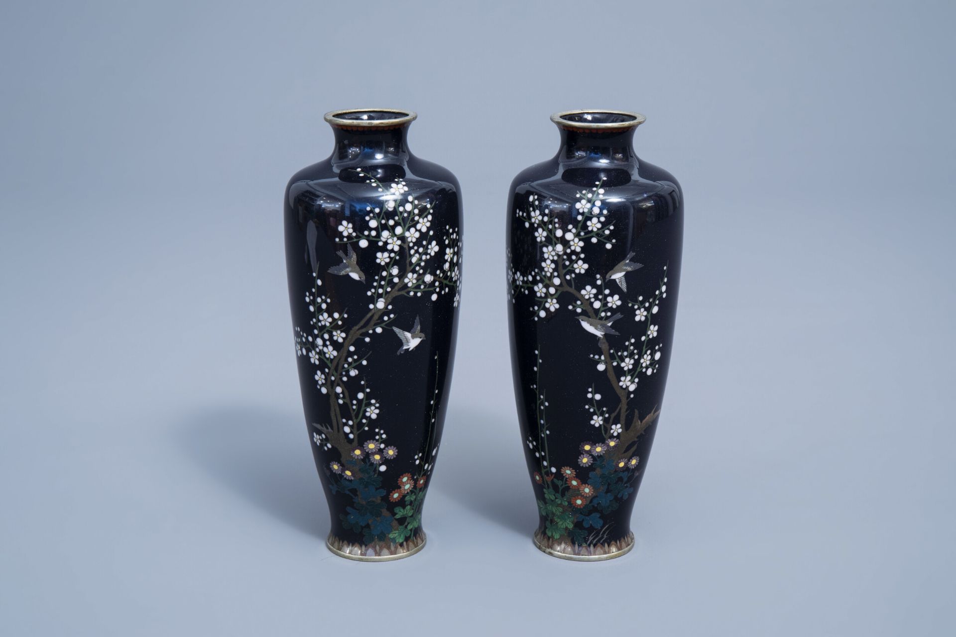 A pair of fine Japanese cloisonne vases with birds among blossoming branches, Meiji, 19th C.