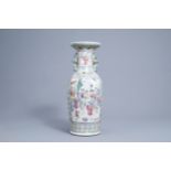 A Chinese famille rose vase with floral and figurative design, 19th C.
