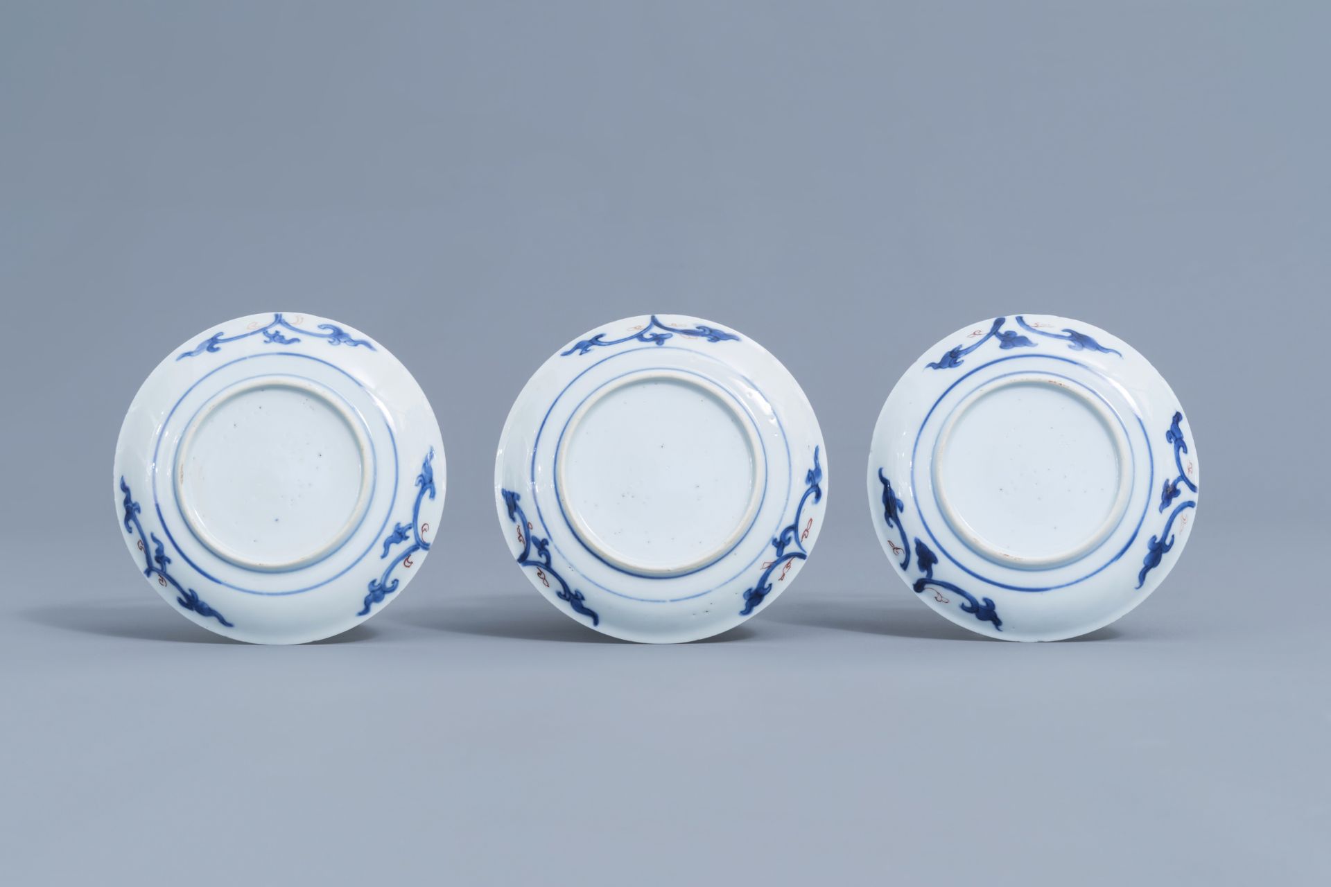 Six Chinese blue, white, iron red and gilt cups and saucers with floral design, Kangxi - Image 10 of 34