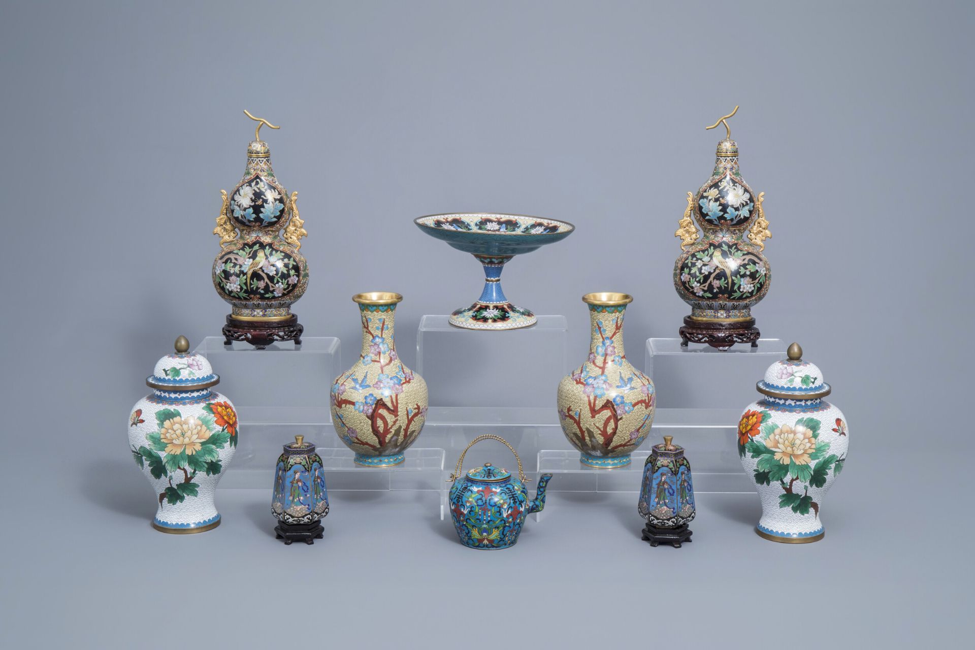 A varied and extensive collection of Chinese cloisonne vases, a teapot and a dish on foot, 20th C.