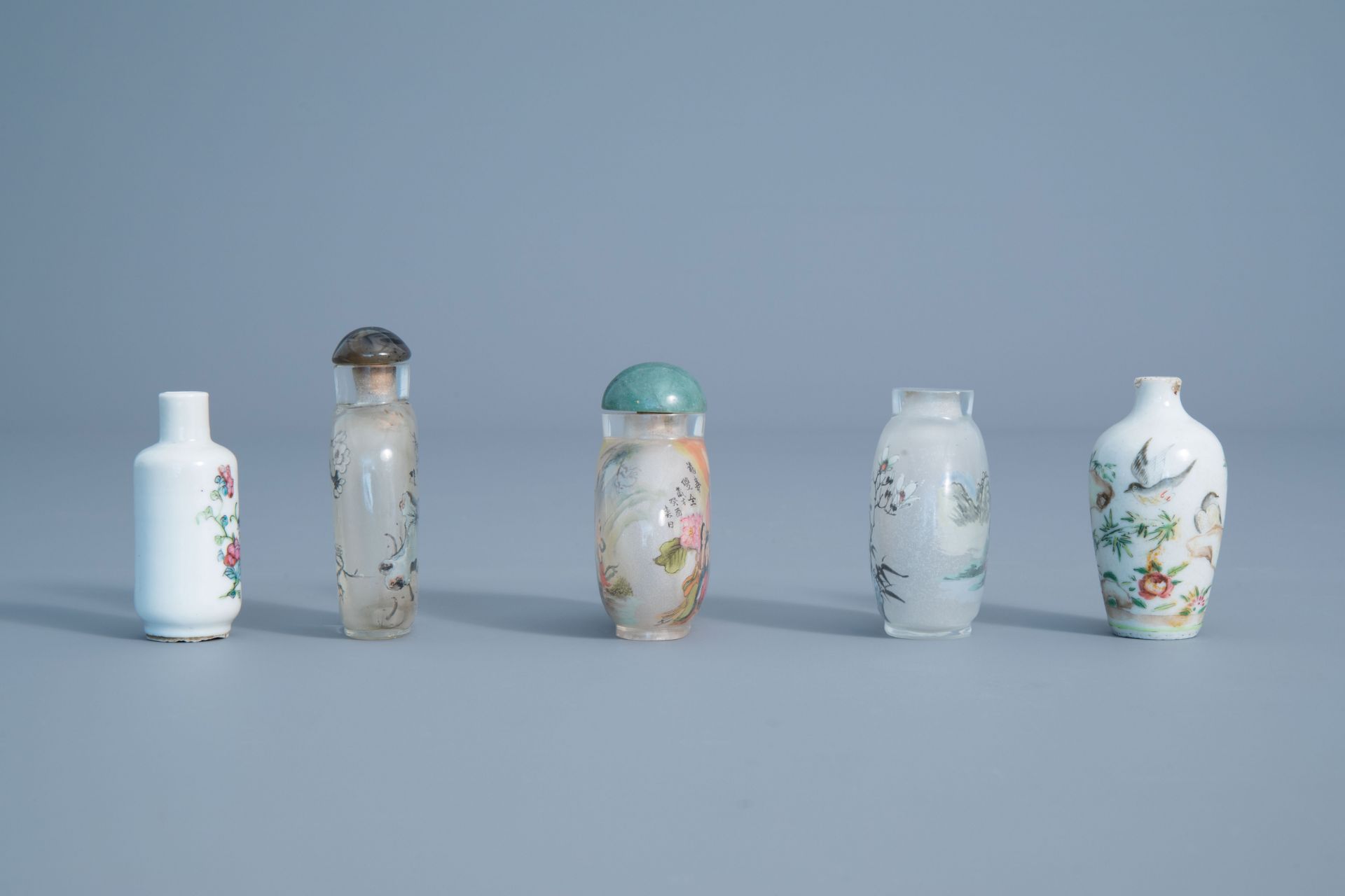 Five Chinese inside-painted glass and porcelain snuff bottles, 19th/20th C.