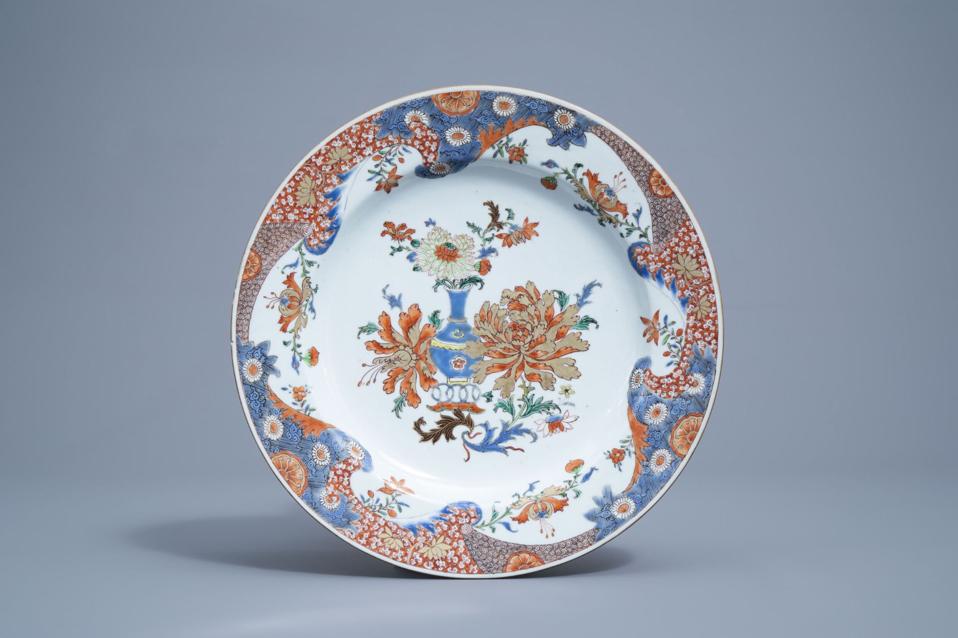 A Chinese verte-Imari charger with a flower vase and floral design, Yongzheng