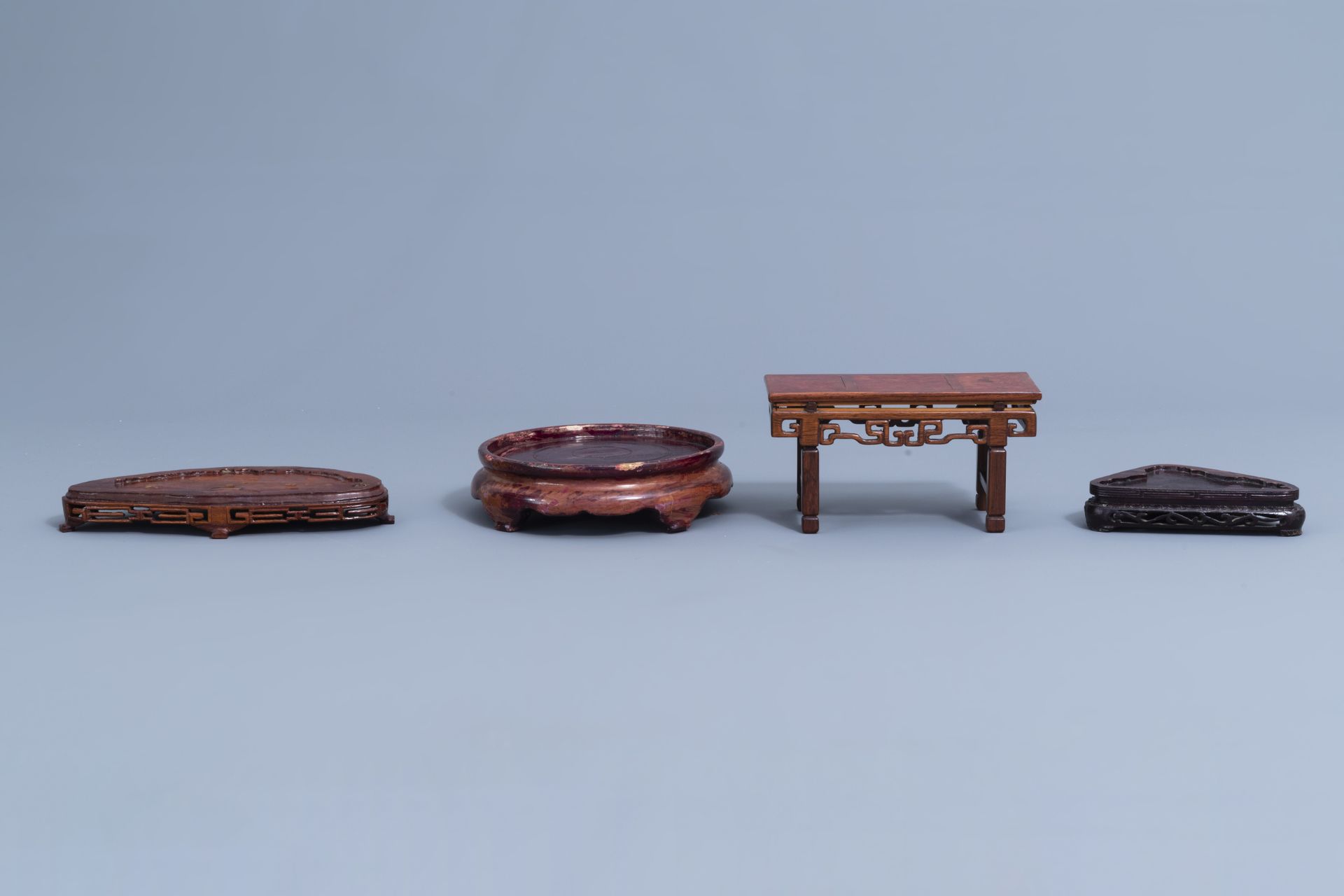 A collection of Chinese carved wooden stands, 19th/20th C. - Image 23 of 32