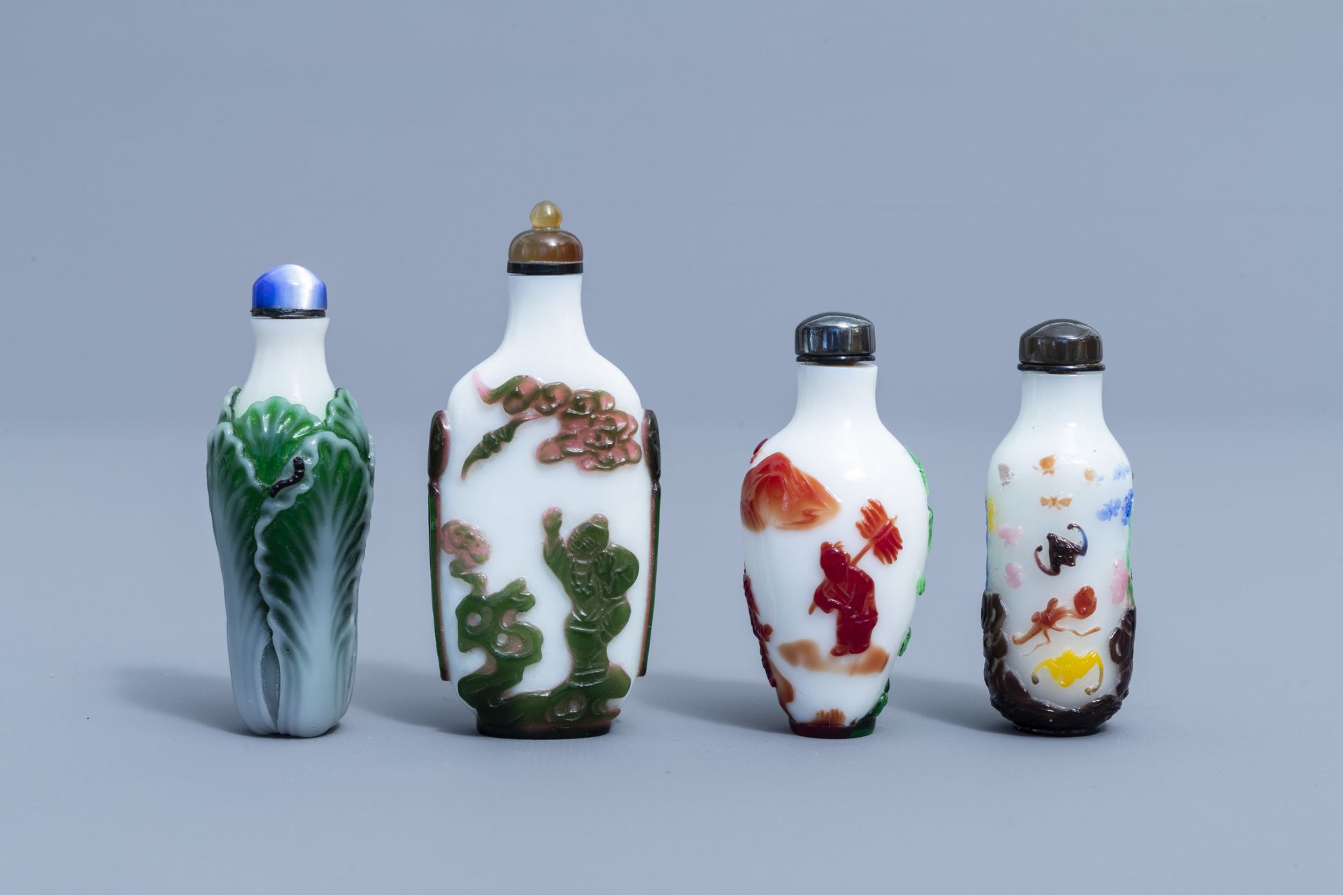 Eight Chinese overlay glass snuff bottles, 20th C.