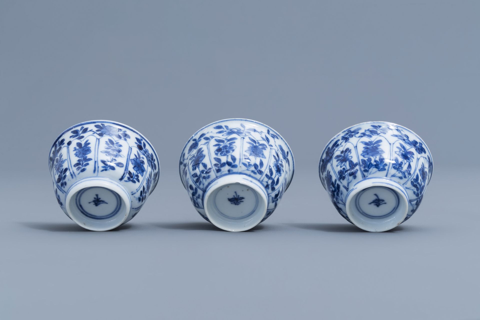 Three Chinese blue and white cups and saucers with floral design, Kangxi - Image 8 of 9