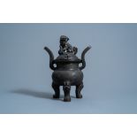 A Chinese bronze tripod censer and cover, Ming