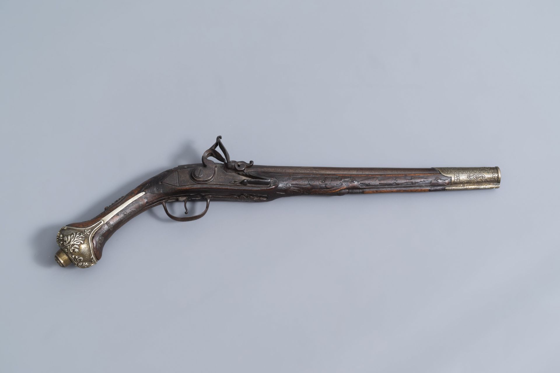 An Ottoman coral inlaid and silver mounted flintlock pistol, Algeria, 18th C.