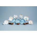 A varied collection of Chinese blue, white, famille rose, Imari style and iron red cups and saucers,