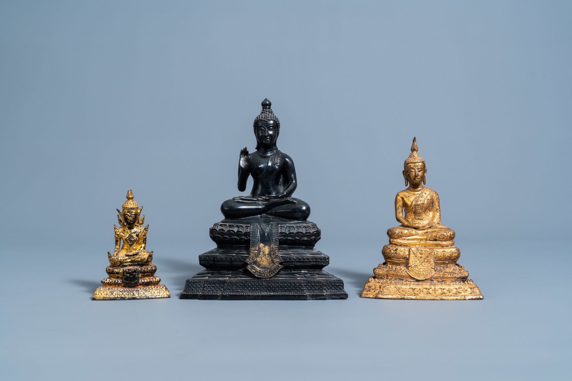 Three gilt and patinated bronze figures of Buddha, Southeast Asia, 19th/20th C.