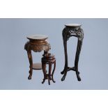 Three Chinese wood stands, one with marble top, 20th C.