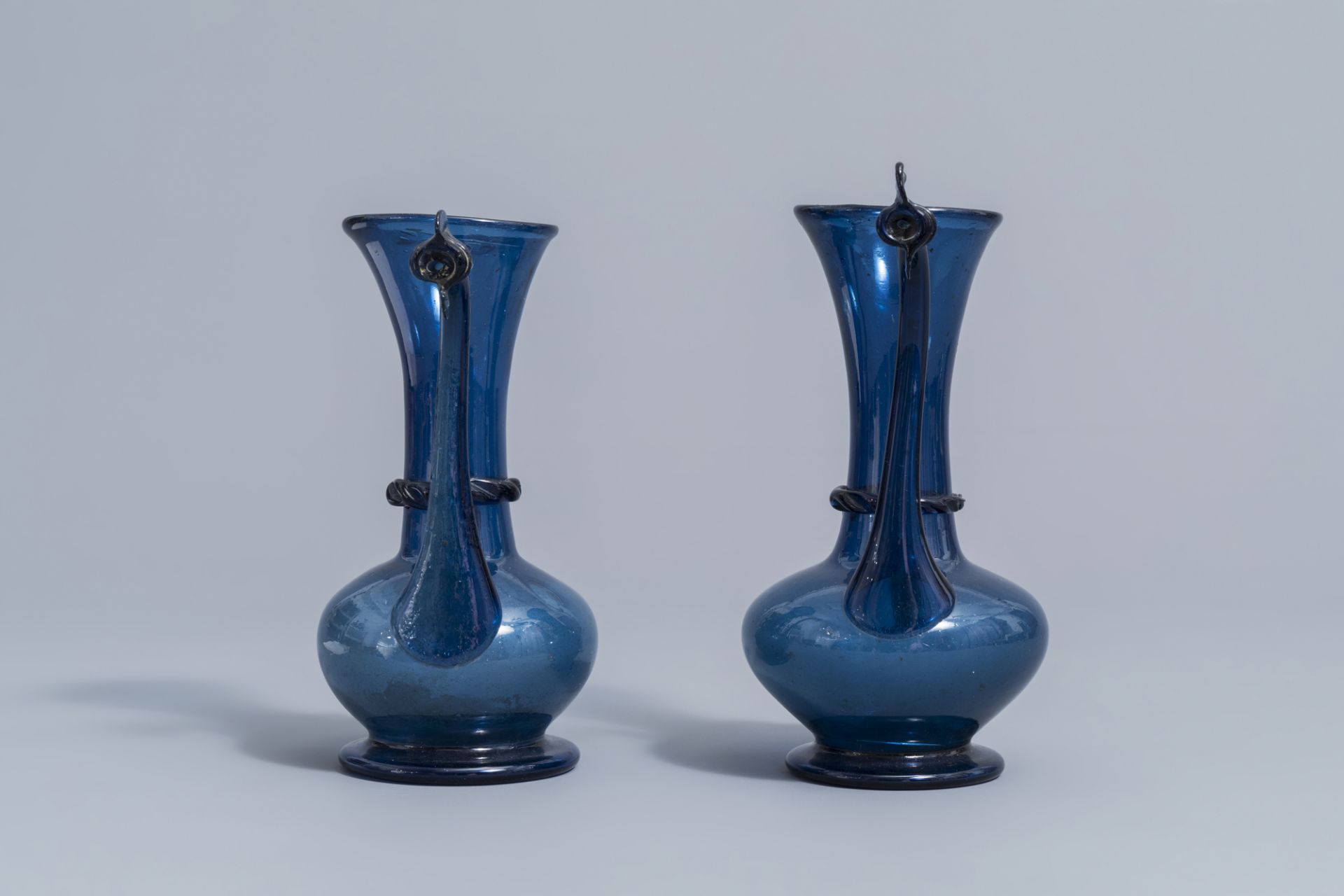 A pair of Islamic blue coloured relief decorated glass ewers or rosewater sprinklers, Qajar, Iran, 1 - Image 5 of 10