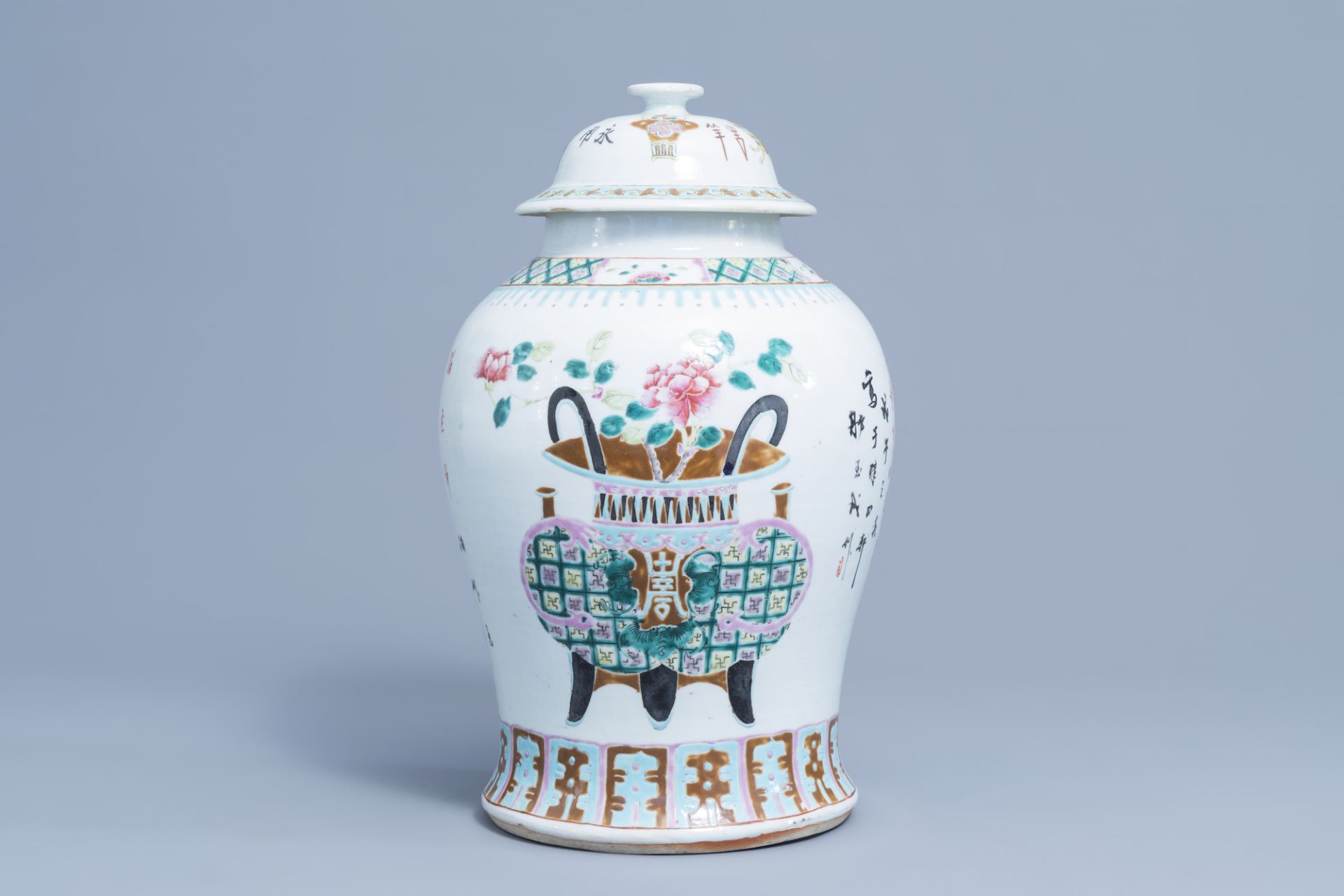 A Chinese famille rose vase and cover with flower baskets, 19th C.