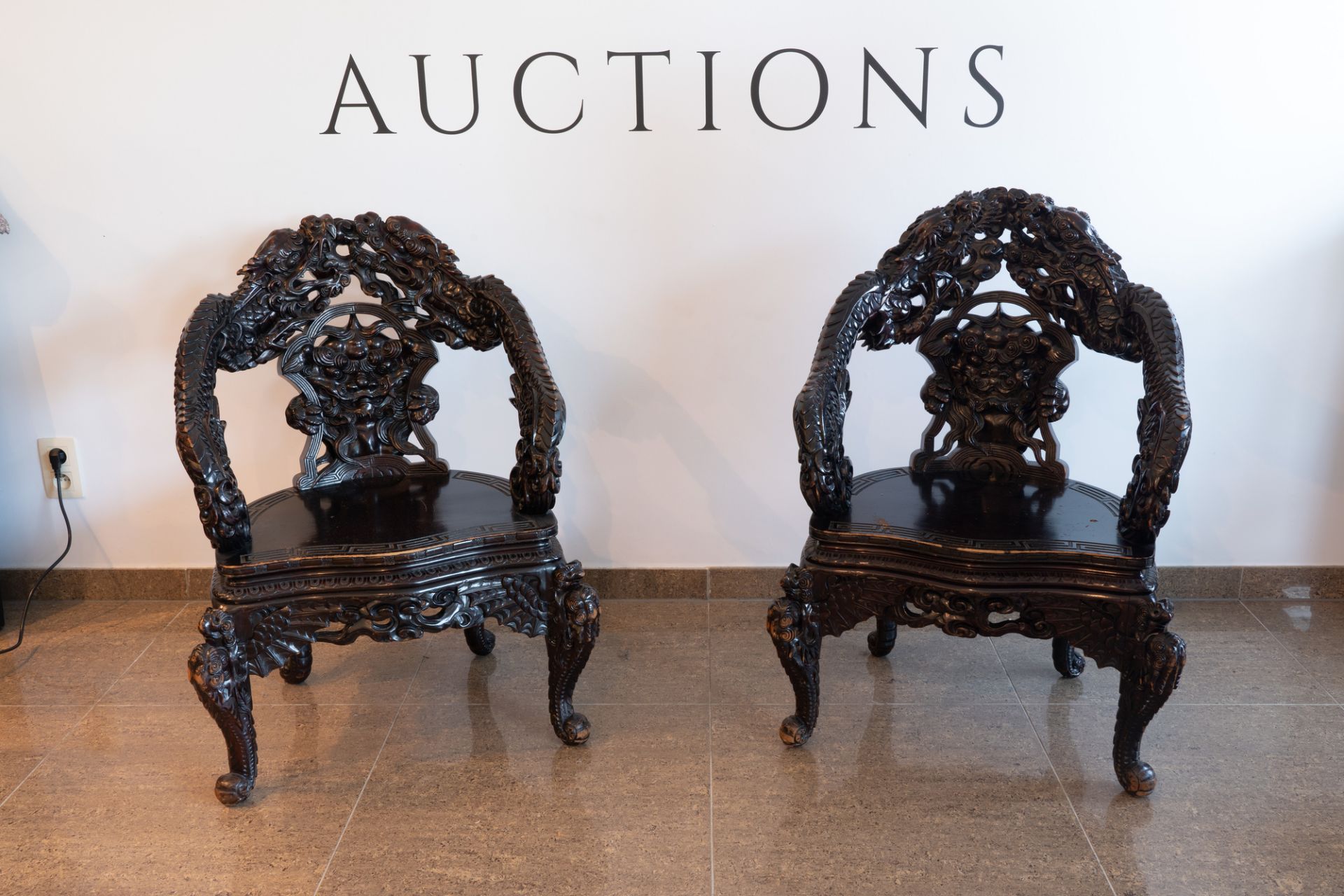 A pair of Chinese or Japanese carved wooden 'dragon' chairs, 19th/20th C. - Image 2 of 8