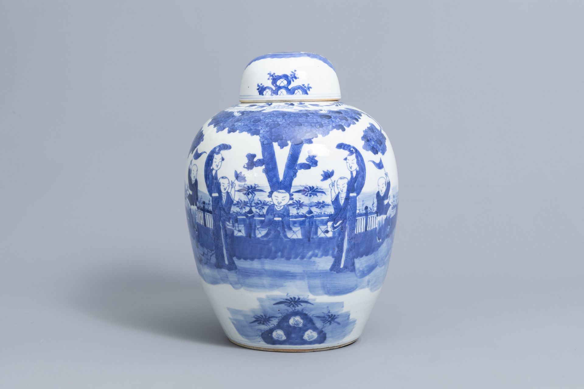 A Chinese blue and white jar and cover with figures on a terrace, Kangxi mark, 19th C.