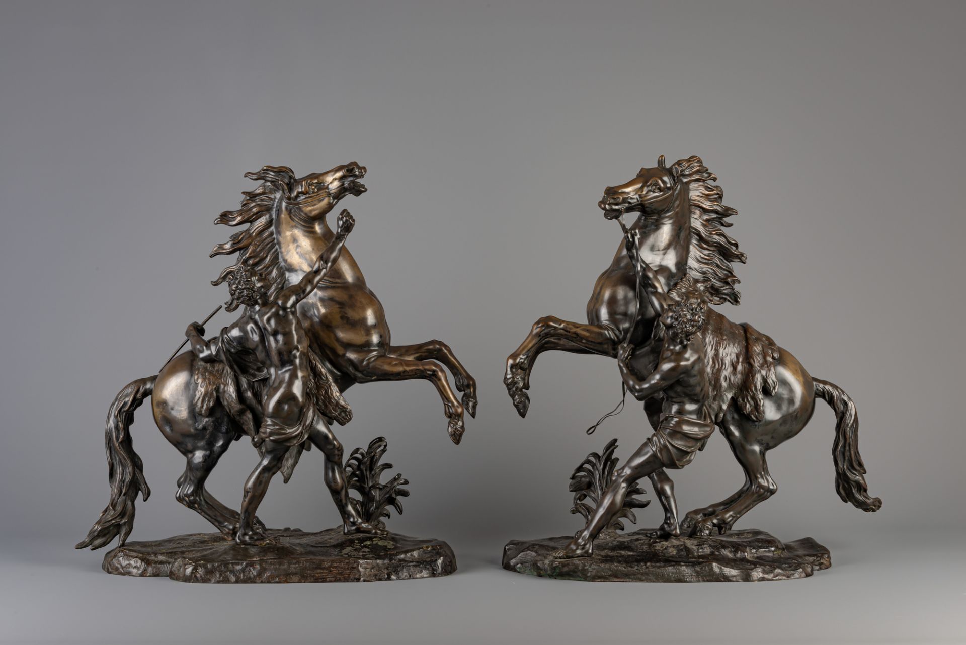 After Guillaume Coustou the Elder (1677-1746): A pair of Marley horses, patinated bronze, France, 19