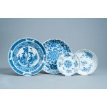 Four various Chinese blue and white chargers and plates with floral design and figures in a landscap