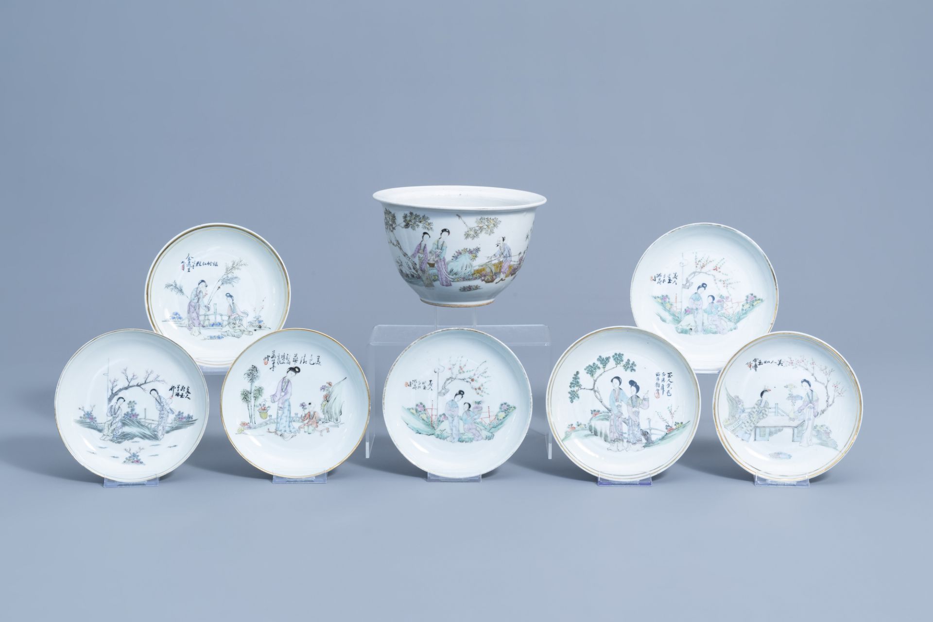 Seven Chinese qianjiang cai saucer plates and a jardiniere with figures in a flower garden, 19th/20t