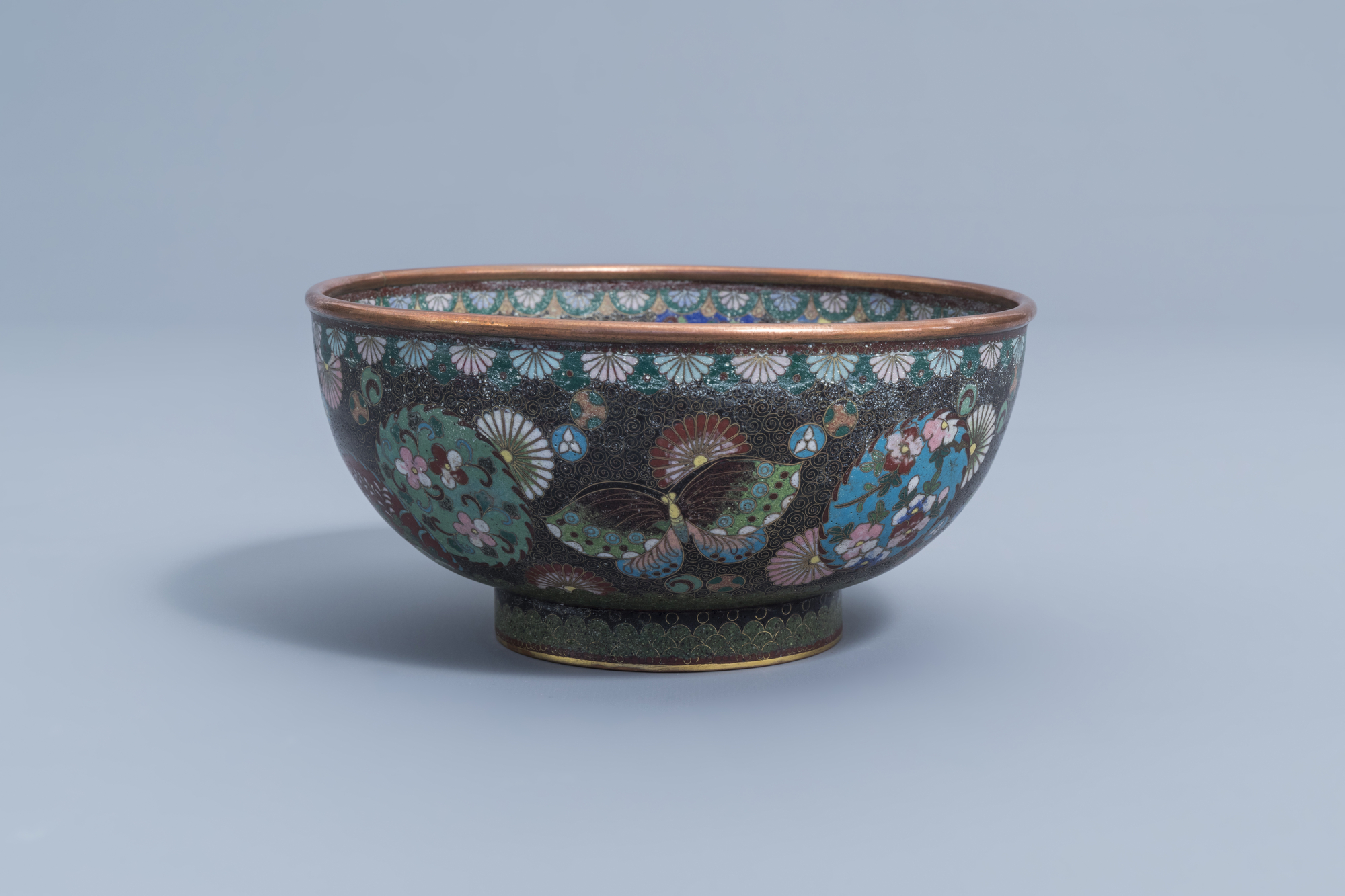 A Japanese cloisonne bowl with a phoenix, butterflies and floral design, Meiji, ca. 1900