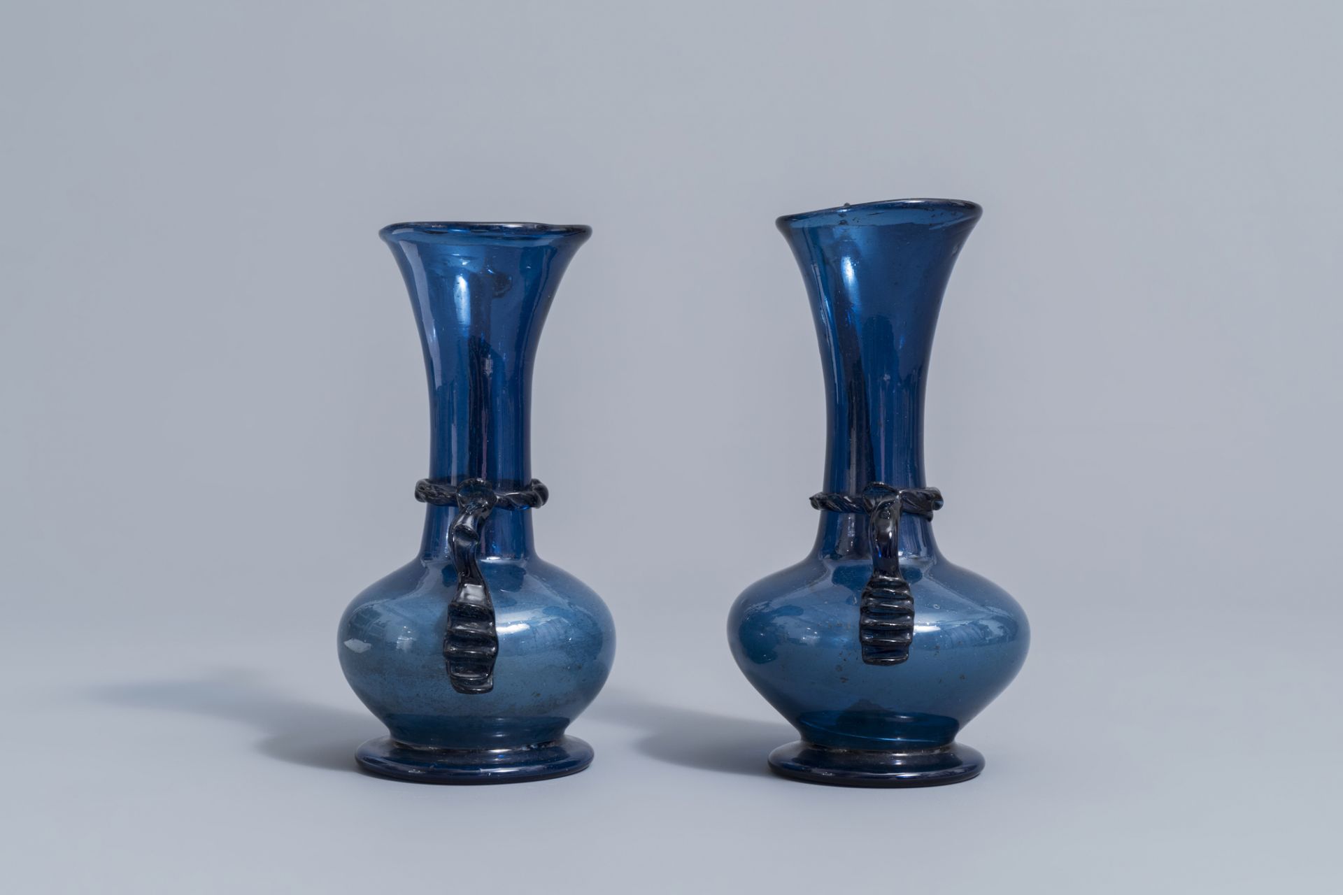 A pair of Islamic blue coloured relief decorated glass ewers or rosewater sprinklers, Qajar, Iran, 1 - Image 3 of 10